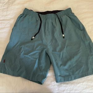 Rhone gym shorts. Teal blue in size large. Hybrid shorts for gym or swim.